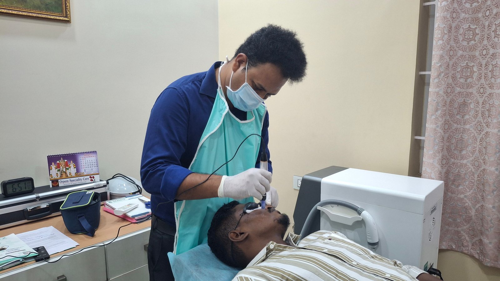 Patient receiving targeted therapy session in procedure suite